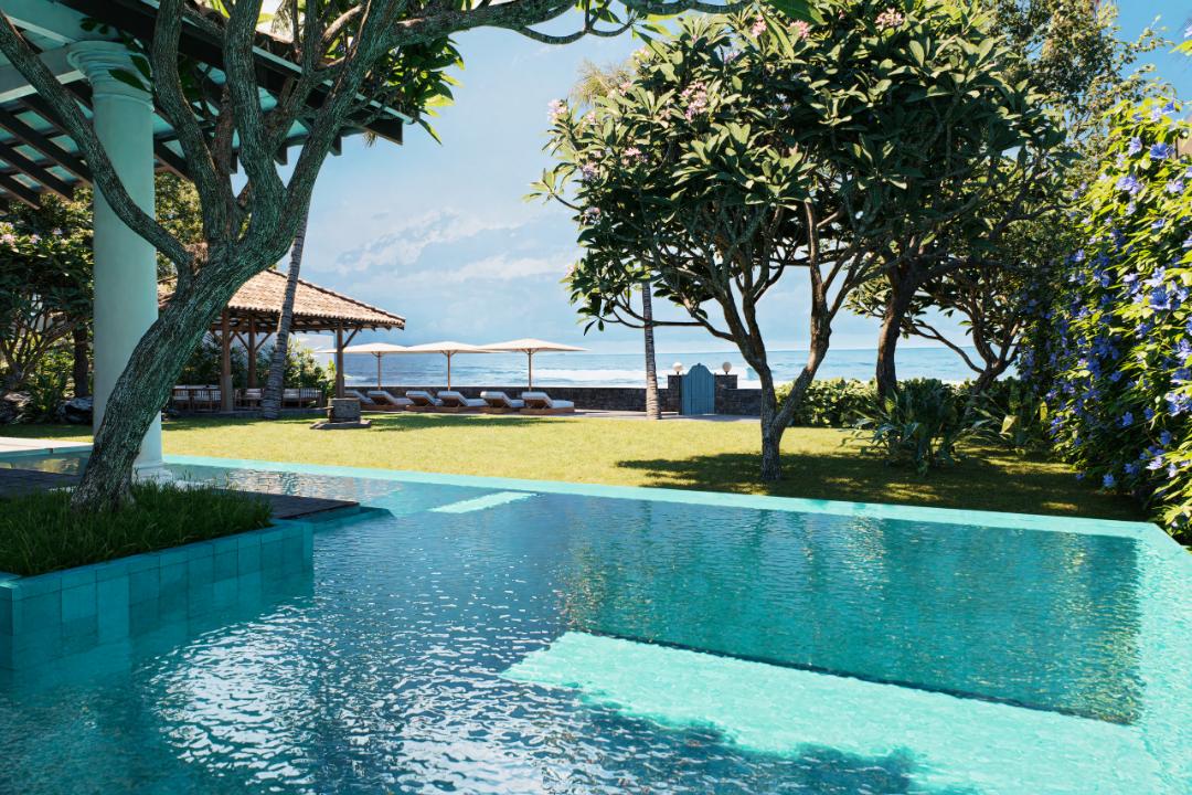 Turquoise swimming pool with tropical surroundings