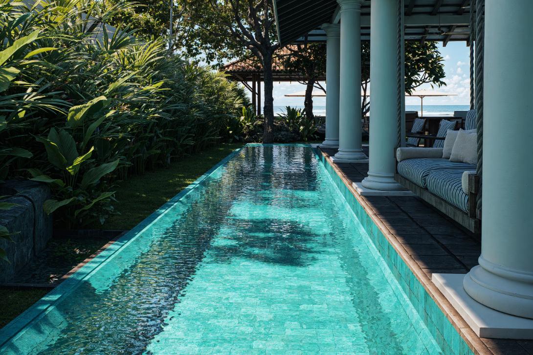 Tropical oasis with turquoise pool & sea